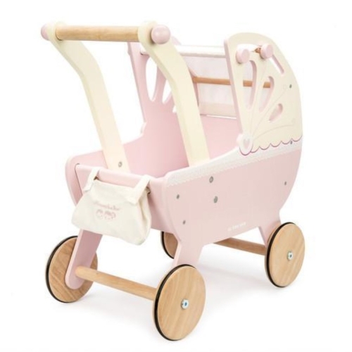 Le jouet de poupées rose avec blanc